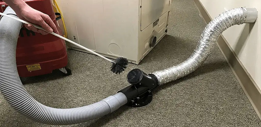 Dryer vent cleaning service removing lint from a dryer duct connection in Buffalo, NY