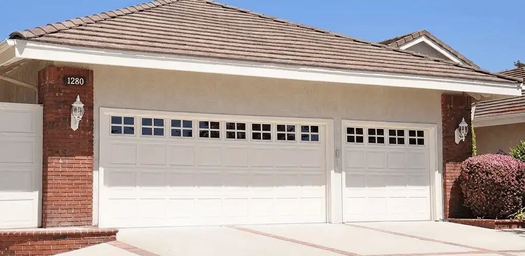 Residential garage door repair service for a double garage door in Buffalo, NY