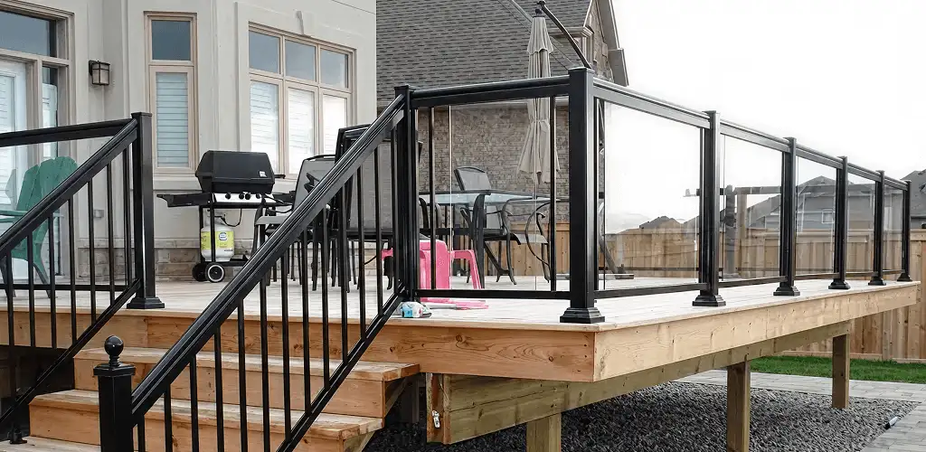 Handrail installation on a deck staircase for safety and code compliance in Buffalo, NY